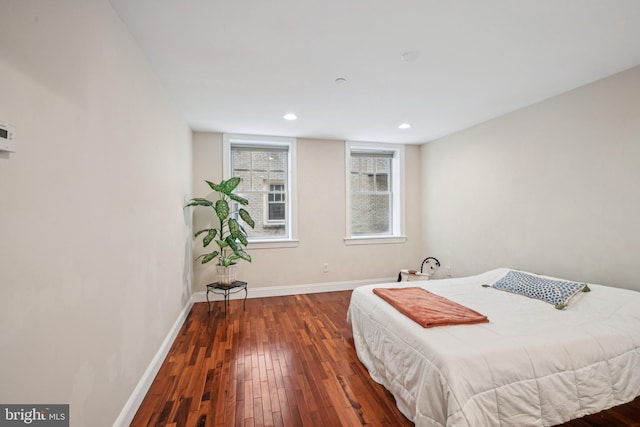 bedroom featuring hardwood / wood-style floors, recessed lighting, and baseboards