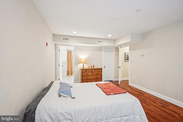 bedroom featuring recessed lighting, wood finished floors, visible vents, and baseboards