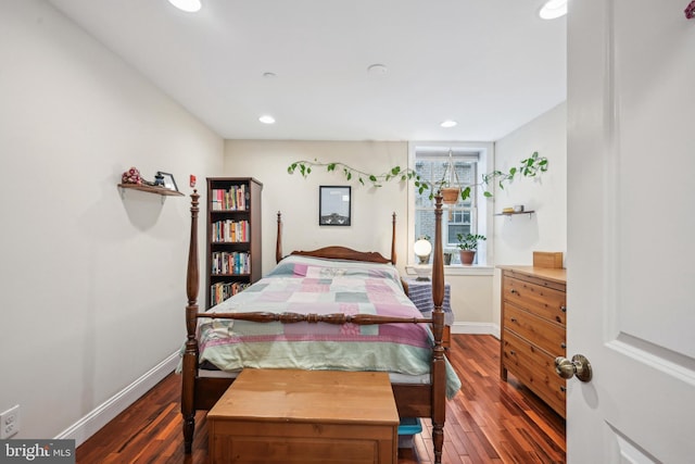 bedroom with baseboards, dark wood finished floors, and recessed lighting