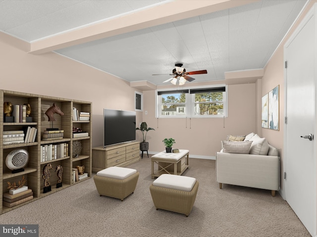 living room featuring a ceiling fan and carpet