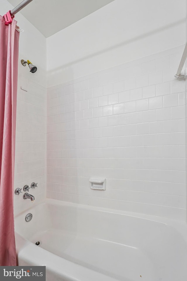 full bathroom with shower / bath combo with shower curtain