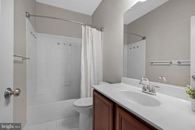 bathroom featuring shower / tub combo with curtain, vanity, toilet, and tile patterned floors