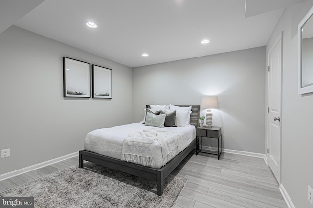 bedroom featuring recessed lighting, light wood-style flooring, and baseboards