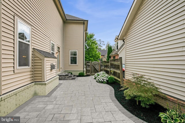 view of patio / terrace featuring fence