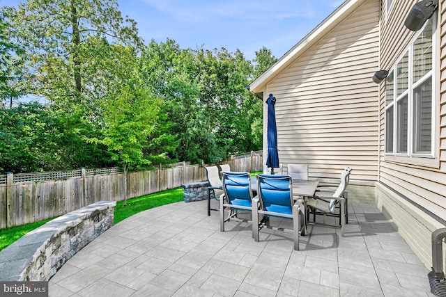 view of patio / terrace featuring a fenced backyard and outdoor dining space