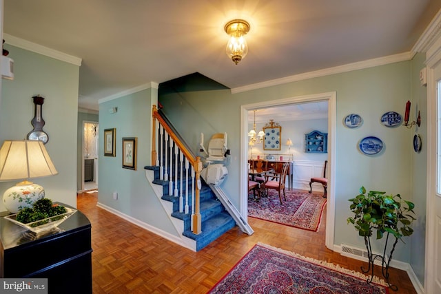 stairs featuring baseboards and crown molding