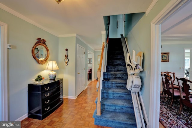 staircase with baseboards and ornamental molding