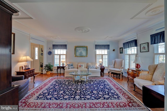 living room featuring crown molding and wood finished floors