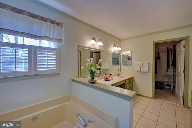 full bath featuring vanity, tile patterned flooring, a bath, and crown molding