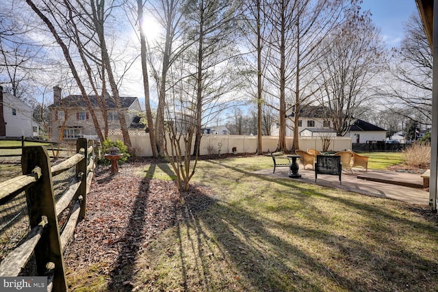 view of yard with a fenced backyard and a patio