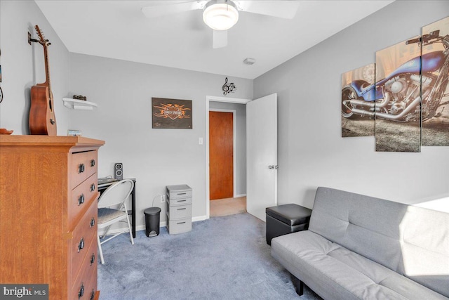 office space with carpet flooring, ceiling fan, and baseboards