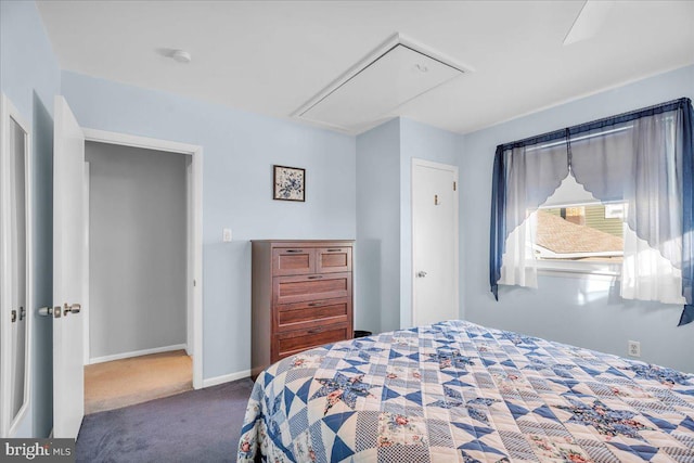 carpeted bedroom featuring attic access and baseboards