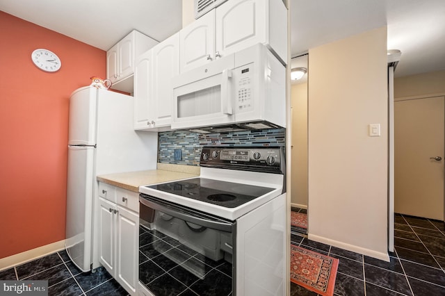 kitchen featuring white appliances, white cabinetry, decorative backsplash, and light countertops