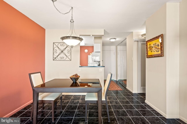 dining room with baseboards