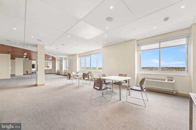 dining area featuring recessed lighting, baseboards, an AC wall unit, and carpet flooring