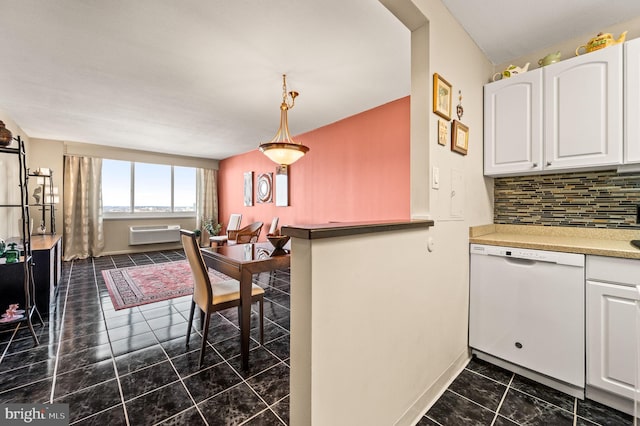 kitchen featuring a wall unit AC, white dishwasher, backsplash, and white cabinetry