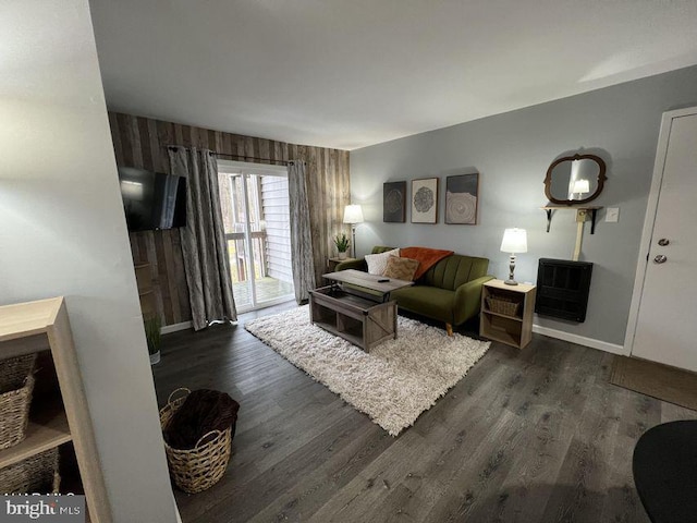 living room featuring dark wood-style floors and baseboards