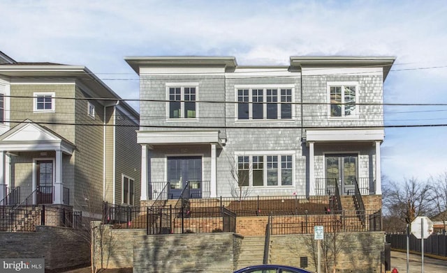 view of front of home featuring fence