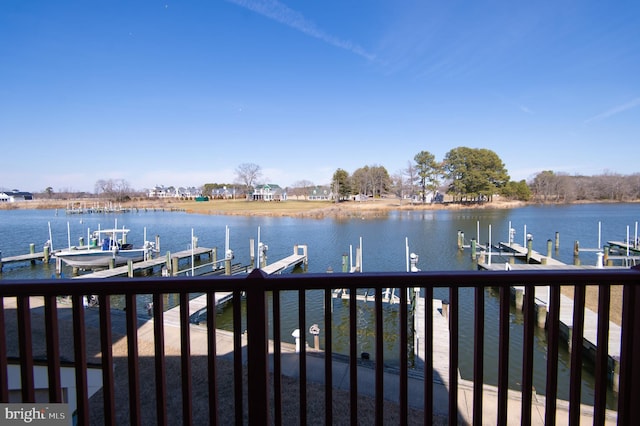 dock area with a water view and boat lift