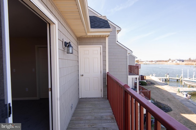 balcony featuring a water view