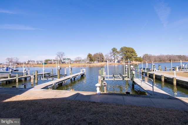 dock area with a water view and boat lift