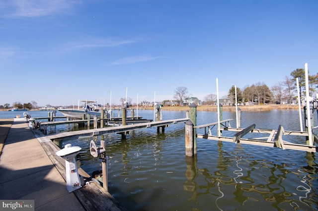 view of dock featuring a water view and boat lift