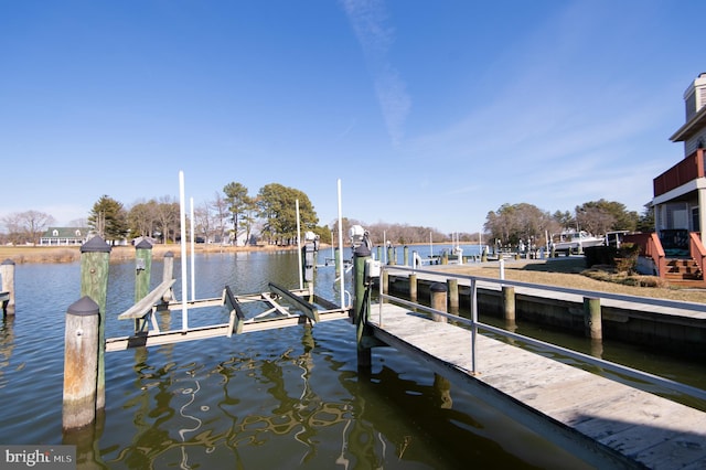 view of dock featuring a water view and boat lift