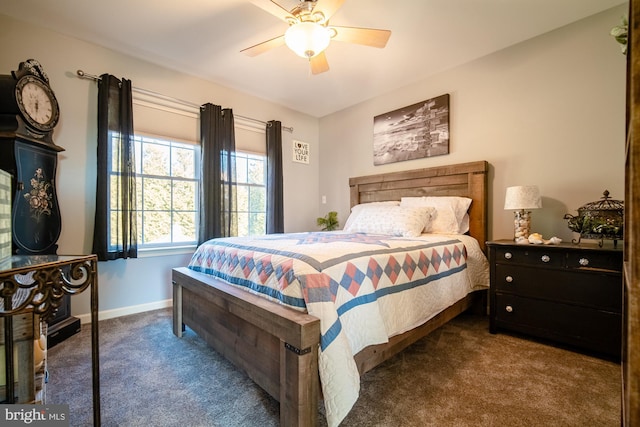 bedroom featuring ceiling fan, carpet flooring, and baseboards