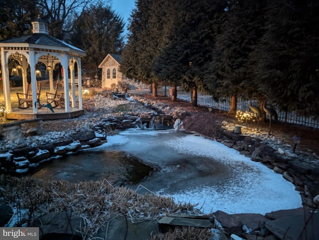 view of yard featuring fence and a gazebo