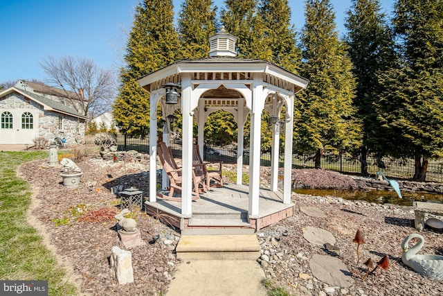 view of yard with fence and a gazebo