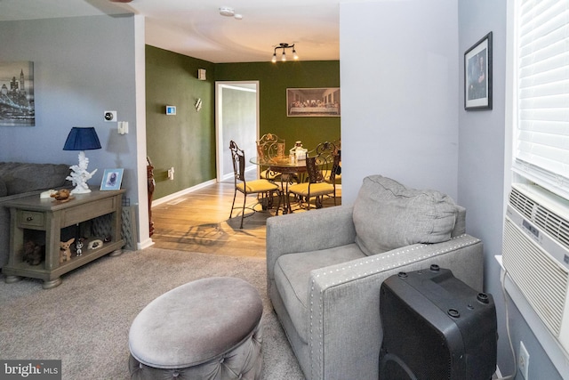 living room with baseboards and wood finished floors