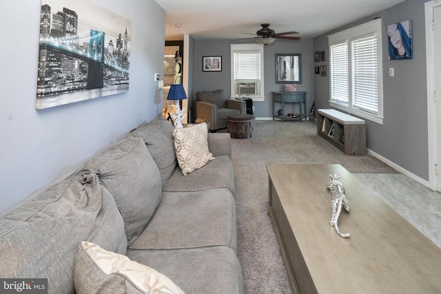 carpeted living room featuring cooling unit, plenty of natural light, baseboards, and ceiling fan