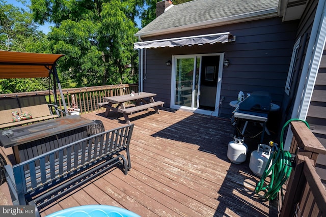 wooden terrace with grilling area