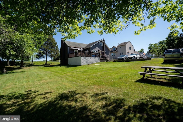 view of yard featuring a wooden deck