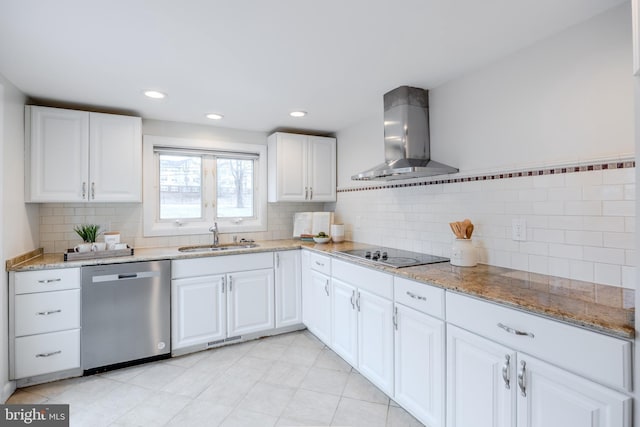 kitchen featuring stainless steel dishwasher, white cabinets, a sink, wall chimney range hood, and black electric cooktop