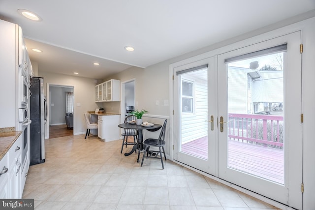 interior space with french doors and recessed lighting