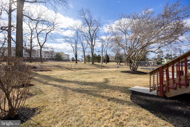 view of yard with a wooden deck