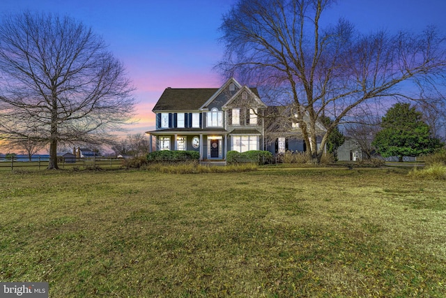 traditional-style house with a front yard