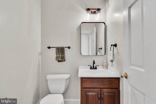 bathroom with toilet and vanity