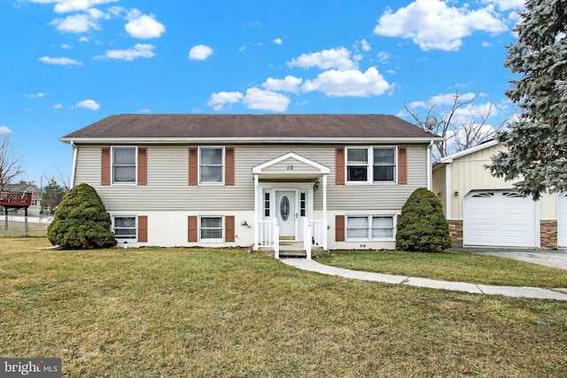 bi-level home featuring a garage and a front yard