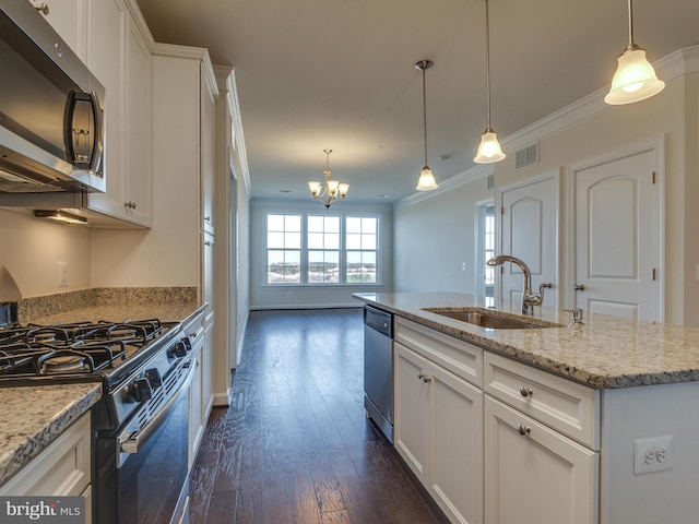 kitchen with visible vents, stainless steel appliances, a sink, and ornamental molding