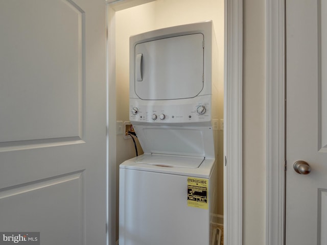 laundry area with stacked washing maching and dryer and laundry area