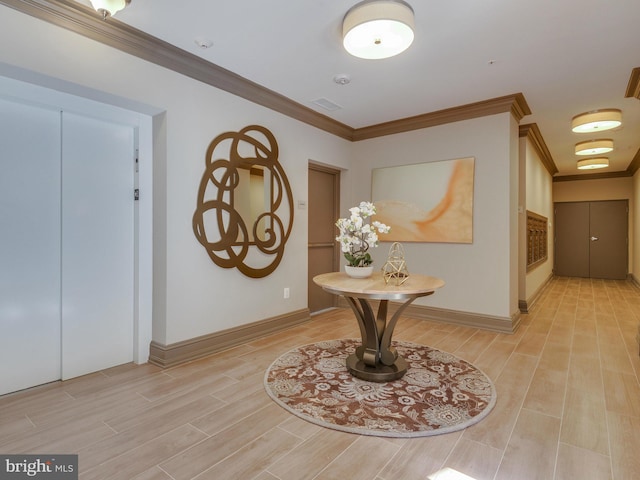 entryway featuring ornamental molding, wood tiled floor, and baseboards