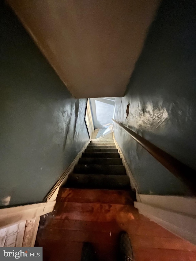 stairs with wood finished floors