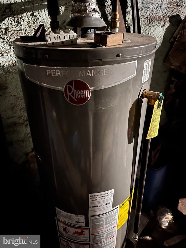 utility room featuring water heater