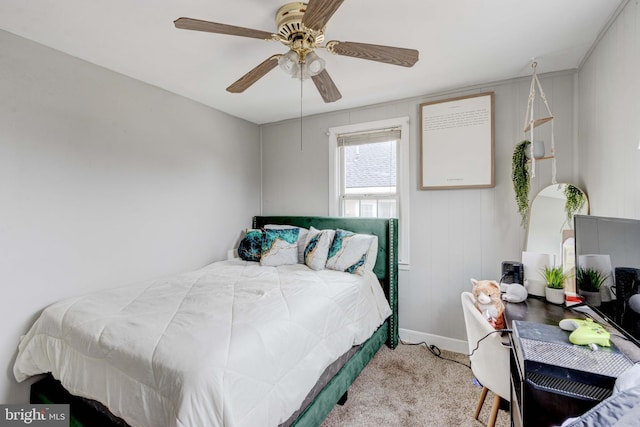 carpeted bedroom with baseboards and a ceiling fan