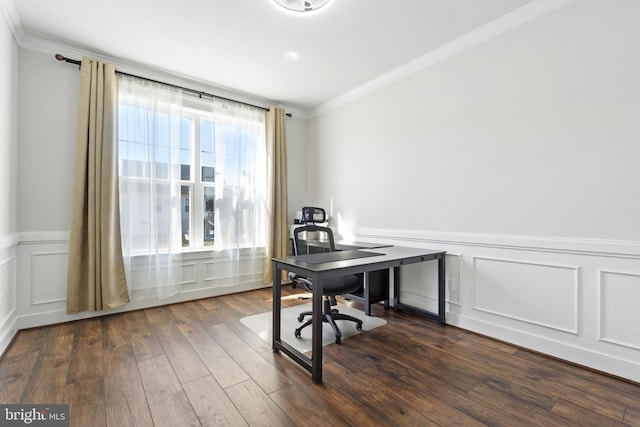 office area with a decorative wall, dark wood finished floors, crown molding, and wainscoting