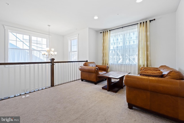 sitting room featuring carpet floors, an inviting chandelier, and recessed lighting