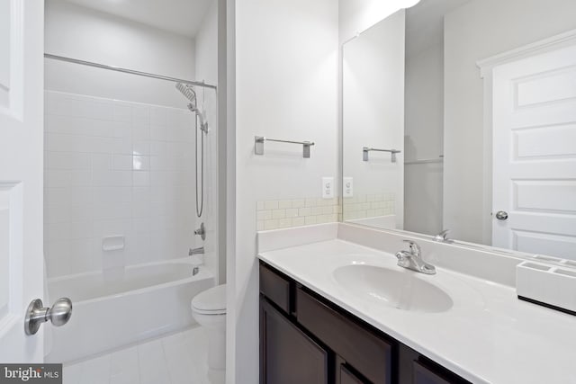 bathroom with tub / shower combination, vanity, and toilet