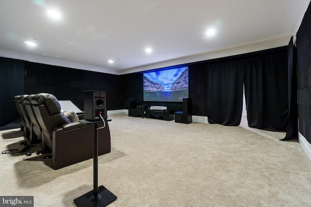 cinema with recessed lighting and light colored carpet